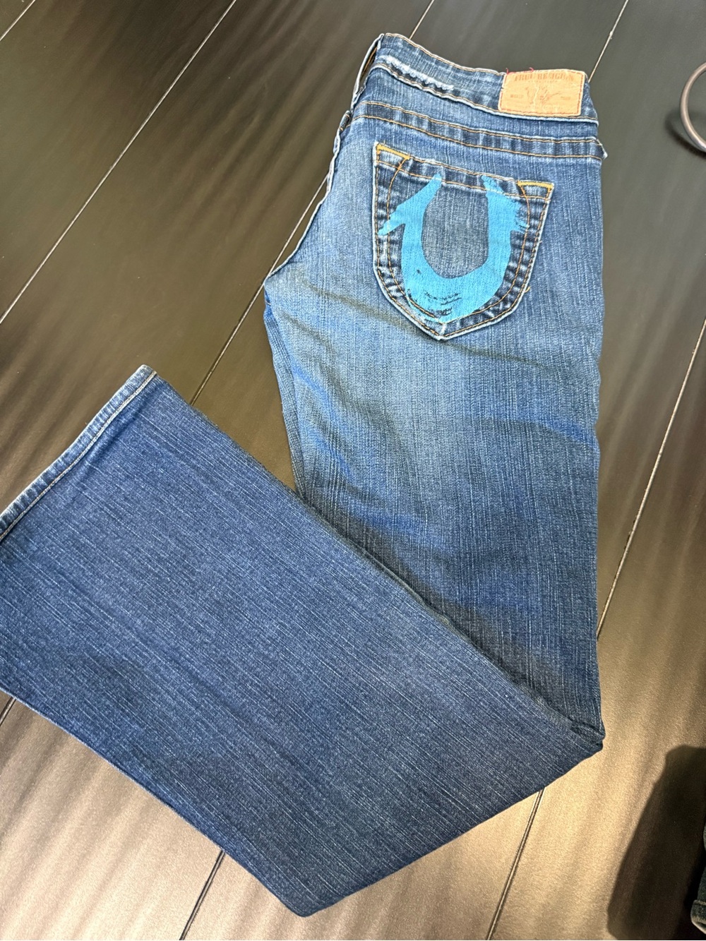 True Religion Blue Jeans with brown Stitch Leather Patch